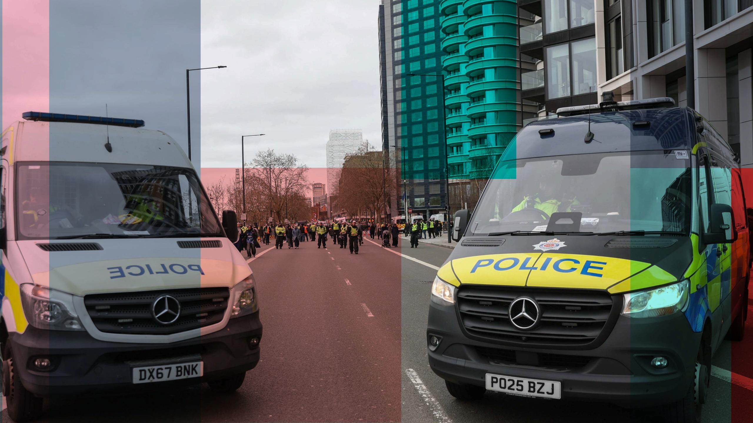 Image of two police vans with a red and blue In.Comms overlay